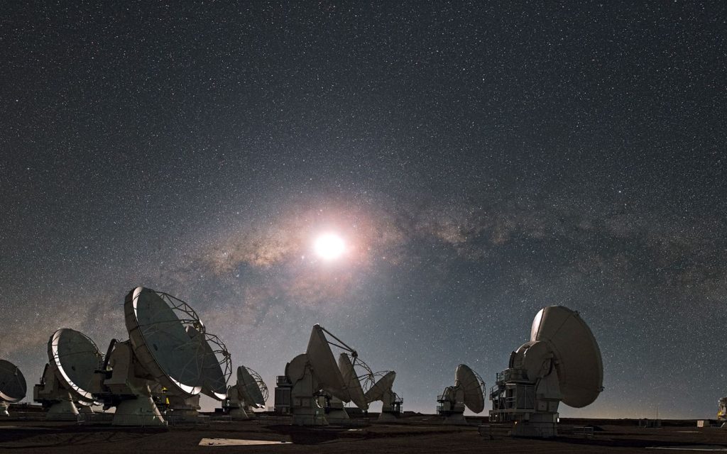 Large radio telescope dishes against the sky
