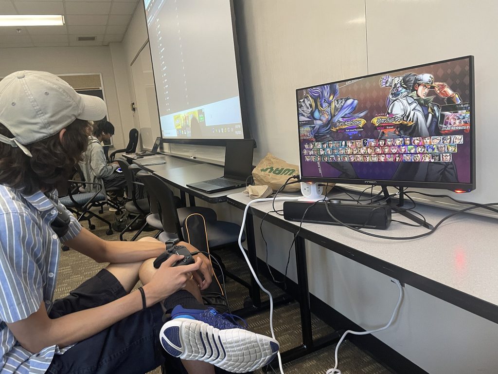 Person playing a video game with a controller